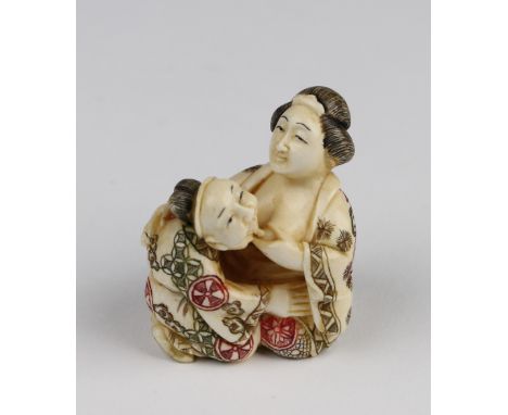 Erotic netsuke, depicting a Japanese man & woman, height 4.8cm approx.