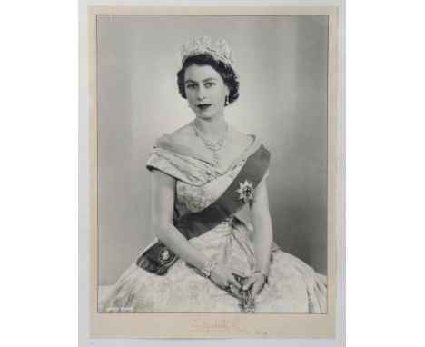 AN AUTOGRAPHED PHOTOGRAPHIC PORTAIT OF QUEEN ELIZABETH II, taken by Dorothy Wilding, signed &amp; dated “Elizabeth R 1954” lo