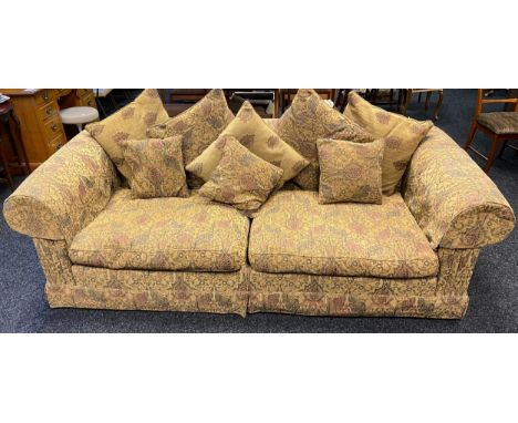 A Large Chesterfield style lounge sofa, designed with feathered cushions. 