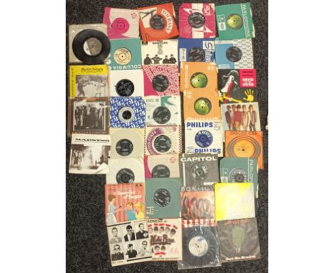 A Collection of 45 R.P.M's to include Beatles, Bob Dylan, Rolling stones, The Beach Boys, Bon Jovi, Bad Manners, Madness and 