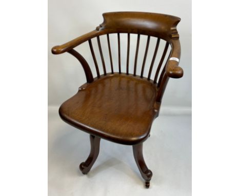 19th century smokers arm chair, upon a ball bearing movement, raised on cabriole legs ending in brass &amp; ceramic castors [