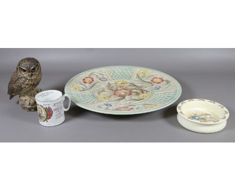 A Woods Burslem Art Deco style charger, Royal Doulton Bunnykins dish and a  Poole pottery model of an owl signed B. Linley Ad