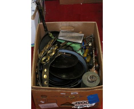 A box of various metalwares to include tools and horse brasses, etc.