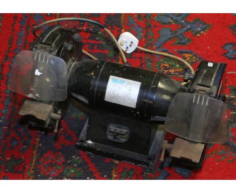 A Wolf bench top grinder.