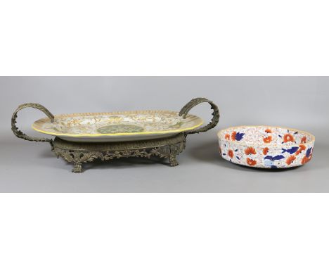 A ceramic meat plate with gilt metal mounts and carry handle, along with a Ironstone china fruit bowl.