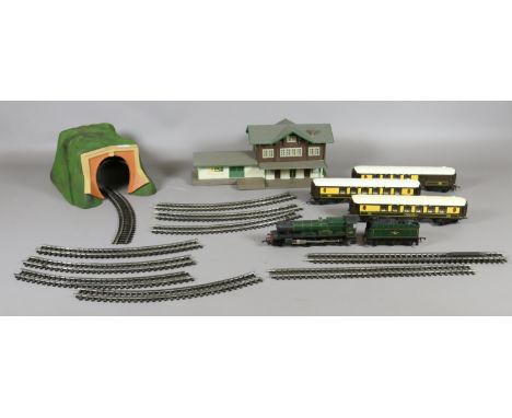 A childs Triang two rail railway set consisting of Albert Hall 4903 engine with tender, three dining coaches, station, track 