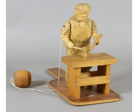 A Black Forest style carved wooden puppet of a wood worker.