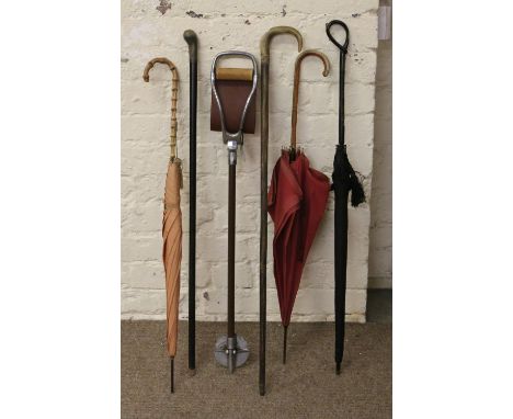 Three ladies parasols along with two walking sticks and Featherwate shooting stick.