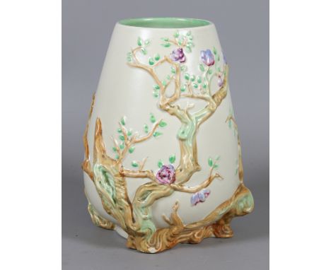 A Clarice Cliff Newport pottery vase moulded with trees.