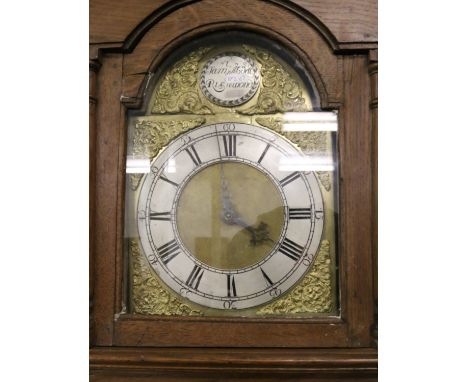 A C19th carved oak thirty hour longcase clock with silvered and brass dial, Roman numerals by Samual Abdel Richmond.
