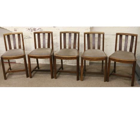 Five oak slat back dining chairs by Heals Tottenham Court Road London. Some light worm to one chair