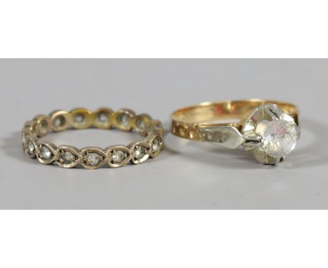 A ladies 9ct gold and diamond eternity ring and a 9ct gold solitaire ring, sizes M & N.