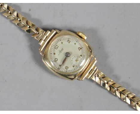 A ladies 9ct gold Avia manual bracelet watch with Arabic numeral markers and subsidiary seconds.