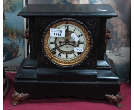 XIX Century American "Ansoonia" Painted Black Cast Metal Mantel clock, with a circular dial, Roman numerals, twin lion handle
