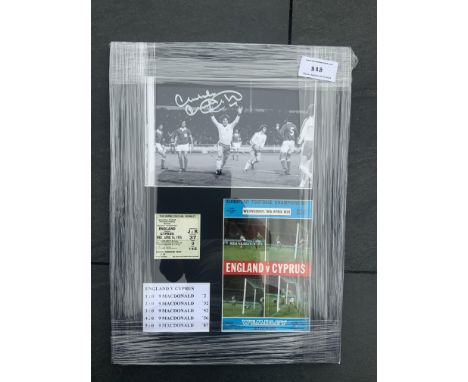 Malcolm MacDonald England 5 Goal Signed Display: Nicely framed and still in wrapper with programme and ticket for match v Cyp