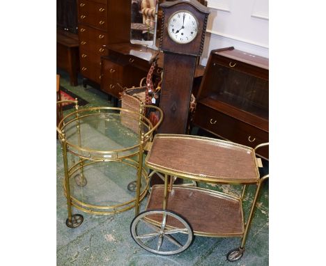 A retro mid-20th century two tier buffet/serving trolley; another; an oak cased longcase clock, of small proportions (3)