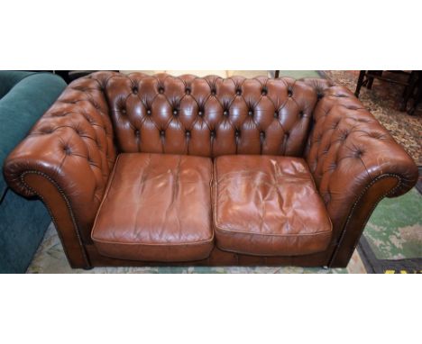 A Chesterfield type scroll arm reception sofa, deep button upholstery, 150cm wide