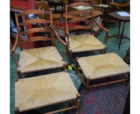 A Country House ladder back rush seated low open armchair; a conforming footstool; another similar (4)