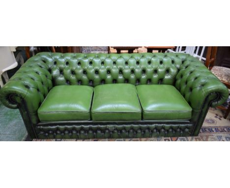A Chesterfield type scroll arm reception sofa, deep button upholstery, 205cm wide