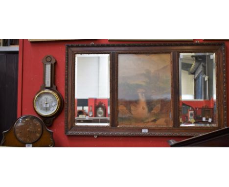 An Edwardian oak over mantel mirror with central landscape panel; an oak wheel barometer, Shortland Smiths; an oak Smiths man