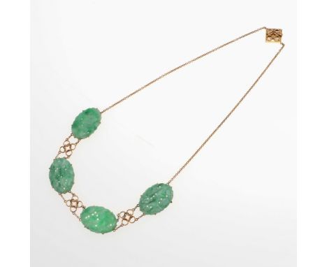 formed with four oval-shaped sections of carved and pierced jade on a 9ct gold chain, 40.5cm long, 12.6 grams. *CR No obvious