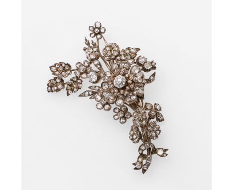 set overall with graduated old-cut and rose-cut diamonds ,set in silver and gold, with detachable brooch fitting, 7cm long, 2