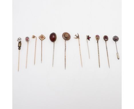 together with ten other assorted gold and gem set stick pins, total weight 19.3 grams. *CR All with some wear.
