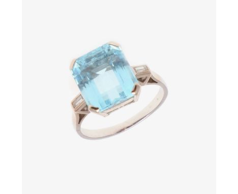 the step-cut aquamarine is set with a baguette-cut diamond to each shoulder, in white gold, 4.6 grams. Size K 1/2. *CR Some v