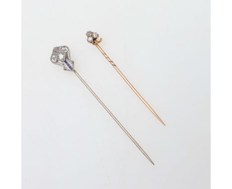 the openwork design mounted with a circular-cut diamond, with blue enamel decoration, together with a diamond and gold trefoi