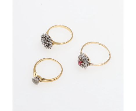 set with a circular-cut diamond in 18ct gold, size O, together with a ruby and diamond cluster ring, set in 18ct gold and pla