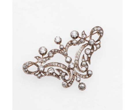 of openwork foliate scrolling design, set overall with graduated old-cut and rose-cut diamonds in silver and backed in gold, 