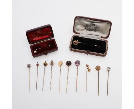 mounted with a circular-cut amethyst, together with eleven other assorted gold and gem set stick pins, total weight 16.5 gram
