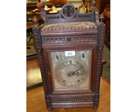 A Victorian Neo-Gothic oak bracket clock, 16cm rectangular silvered dial inscribed with Roman numerals, regulation and silent