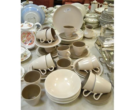 A Poole pottery six setting dinner and tea service, including dinner and side plates , bowls , cups, saucers;  etc qty 
