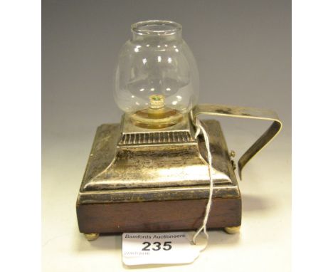 An unusual George V silver battery chamber lamp, glass shade, angular handle, spreading border, bun feet, 9cm wide, maker JFJ
