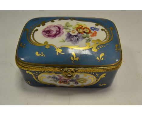 A Limoges porcelain gilt metal mounted rounded rectangular table snuff box, in the Louis XVI taste, decorated with flowers on