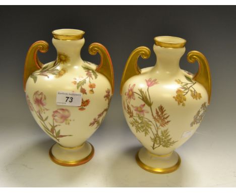 A pair of Royal Worcester two-handled pedestal ovoid vases, printed and painted with wild flower sprigs, in a blush ivory gro