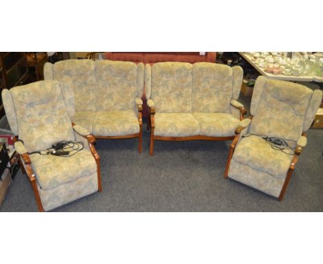 An Ercol style Cottage suite, comprising of two seater sofa upholstered in cream floral pattern; another, an electrical recli