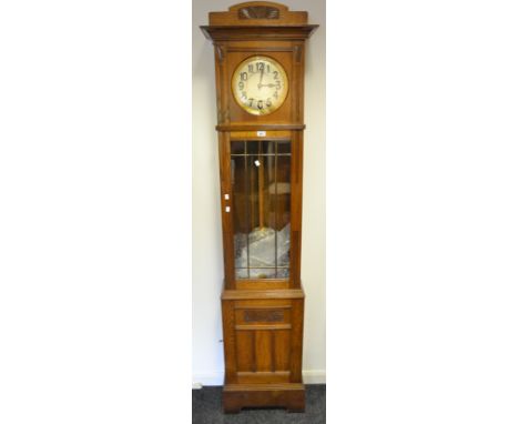 A mid 20th century oak longcase clock, Arabic numerals, twin weights