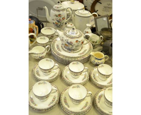 A Wedgwood Kutani Crane six-setting tea and coffee service, comprising baluster coffee pot, tea pot, teacups and saucers, mil