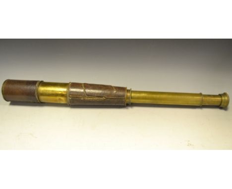 An early 20th century military brass and leather covered three draw telescope