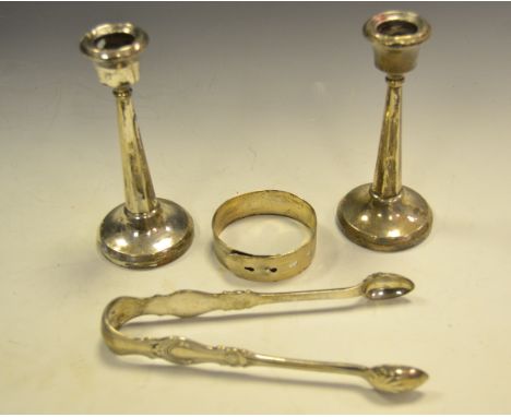 A pair of George V silver boudoir candlesticks, tapering octagonal columns, spreading circular bases, indistinct maker' mark,