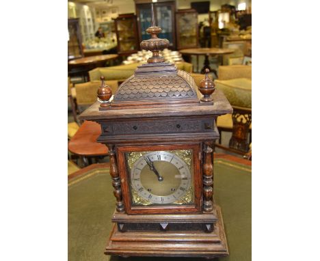 A late 19th century oak bracket clock, 17cm square brass dial with silvered chapter ring inscribed with Roman and subsidiary 