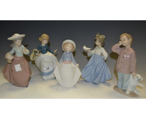 A Nao figure of a boy with a bear; others of young girls, various poses.(5)