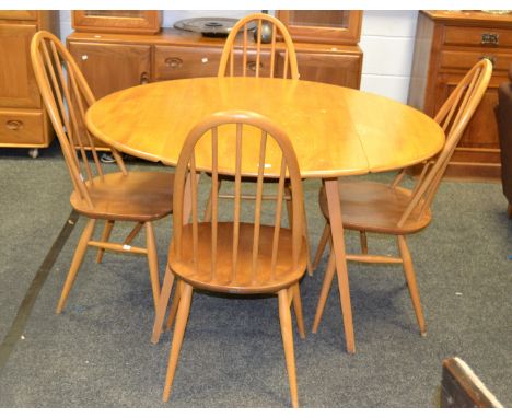 An Ercol dropleaf kitchen table and four chairs