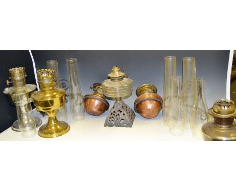 A brass oil lamp; another chronium plated; a pair of copper oil wall lamps; oil lamp chimneys ;  etc (1 box)