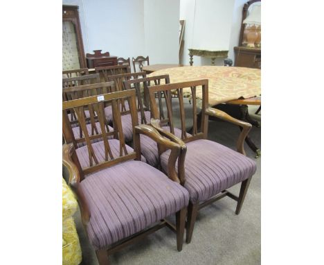 A SET OF EIGHT MAHOGANY FORK BACK DINING CHAIRS including a pair of elbow chairs each with an uphosltered seat on square tape