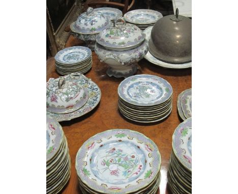 A SEVENTY SIX PIECE IRONSTONE DINNER SERVICE the white and light blue ground with floral panels together with a plated dish c