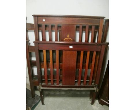 TWO PAIRS OF EDWARDIAN MAHOGANY AND SATINWOOD INLAID BED ENDS with side rails