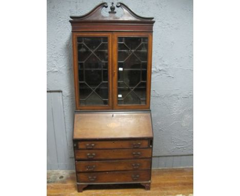 AN EDWARDIAN MAHOGANY AND SATINWOOD CROSS BANDED BUREAU BOOKCASE the architectural pediment above a pair of astragal glazed d